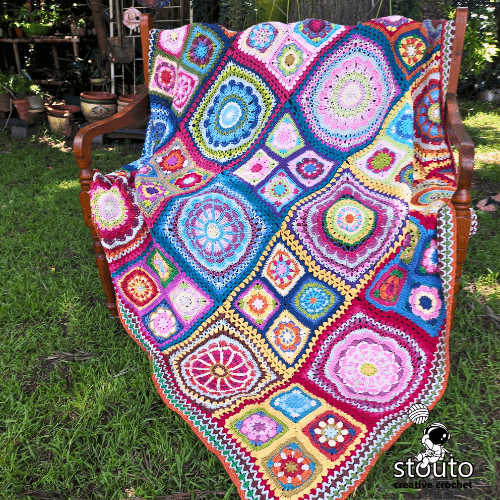 African flowers patchwork afghan with bright colorful crochet squares