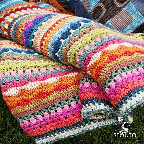 Crochet stitch sampler blanket made with nature-inspired yarn colours