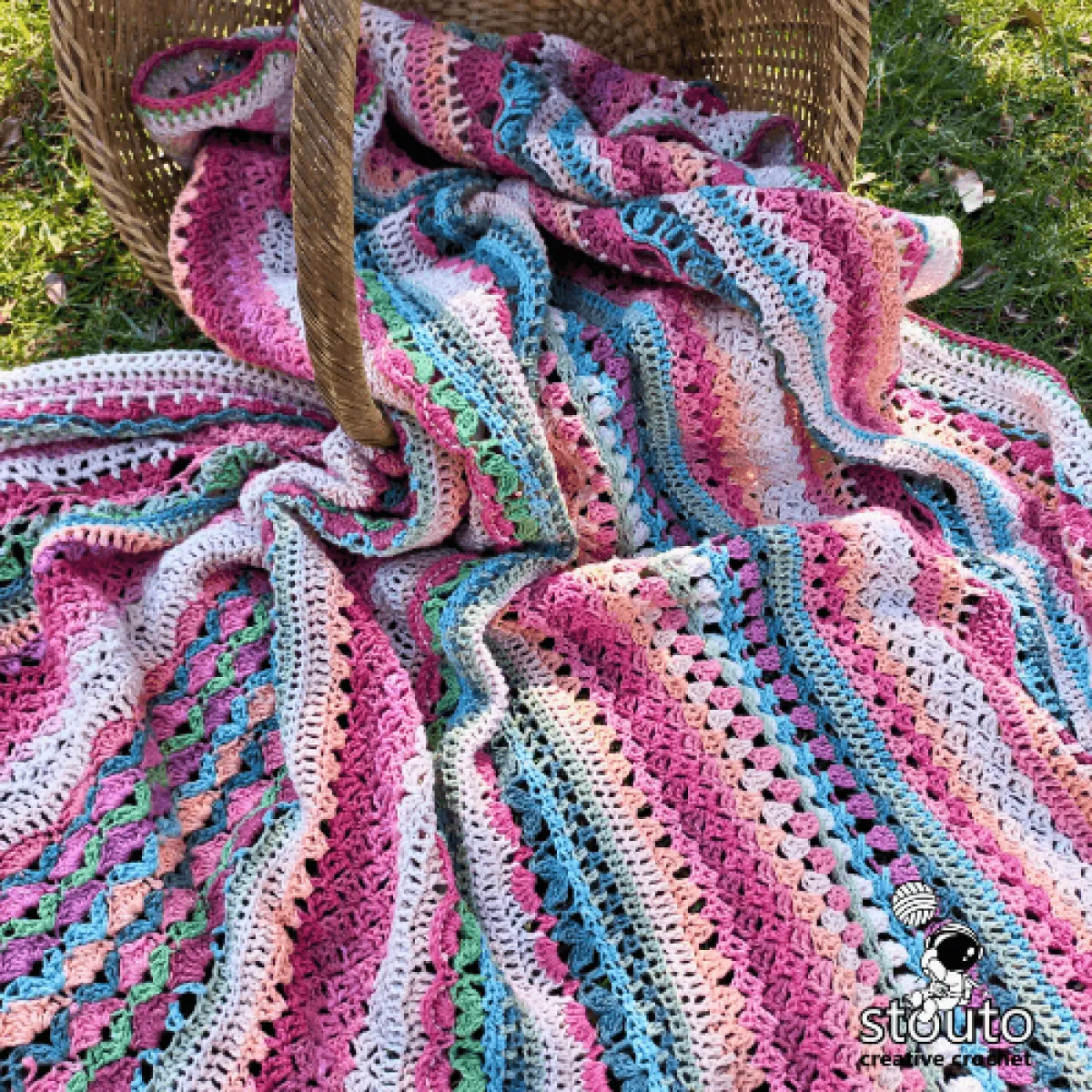Close-up of intricate crochet flower stitch pattern used in the sampler blanket