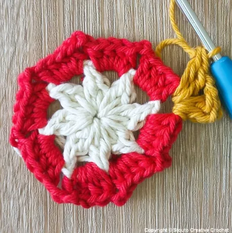 Round 3 of 8 petal African flower crochet pattern building petal shape