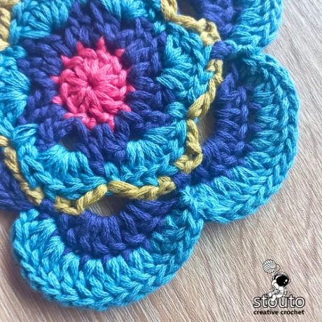 Expanded petal texture in round 6 of the Bold Buttercup crochet square