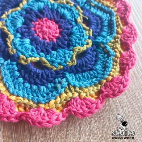 Finished round 9 of the Bold Buttercup flower crochet square
