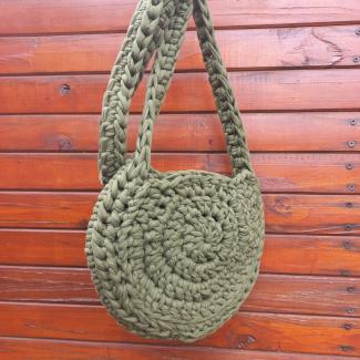 Back of chunky crochet crossbody bag in military green