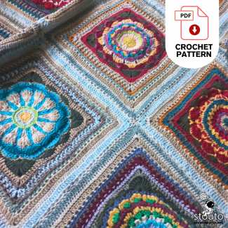 Detailed view of heirloom flower granny square blanket