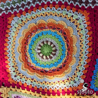 frican patchwork floral mosaic blanket made from large crochet flower squares
