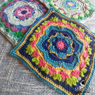 Blocked Bold Buttercup crochet square with sharp corners 