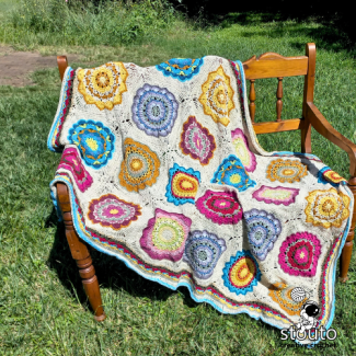 Crochet floral border detail finishing the granny squares blanket