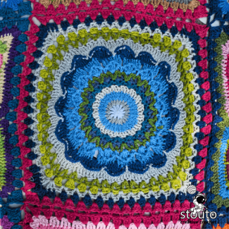 Patchwork crochet flower blanket layout showing joined floral squares