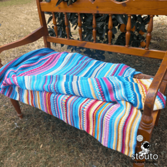 Close-up of daily temperature blanket rows showing stitch texture and color changes