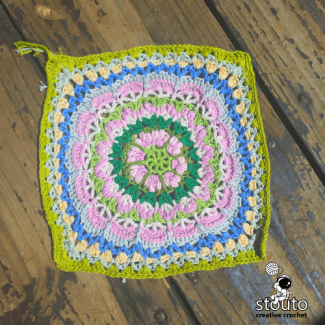 Decorative crochet flower square stitches showing layered texture and structure