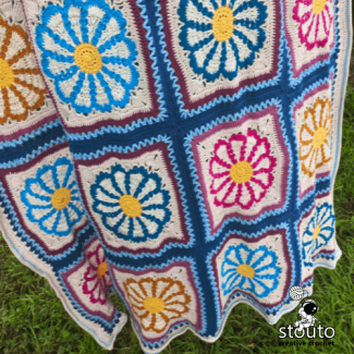 Modern floral granny square blanket with fresh spring color palette