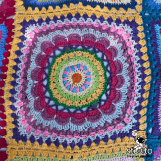 Textured crochet flower square petals in layered bold colors