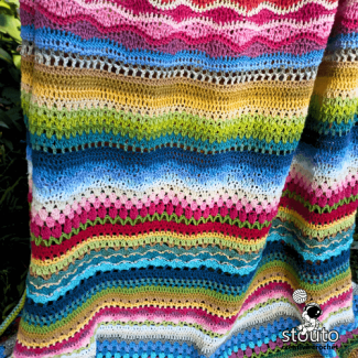 Multi stitch crochet blanket pattern with alternating stitch rows