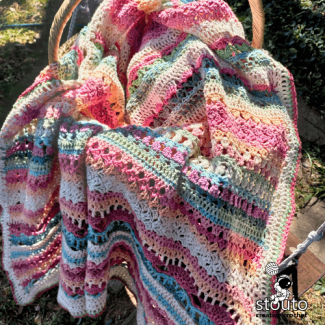 Rose crochet blanket stitch pattern with textured petal-like structure