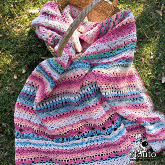 Rosegarden Throw crochet blanket showing rich floral texture and layered stitch definition