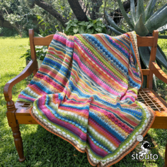 Textured crochet stitch sampler blanket featuring wave and ripple stitches