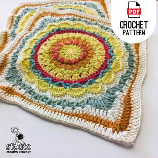 Free crochet granny square pattern featuring a textured floral design.