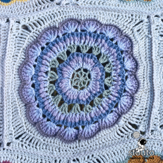 Crochet granny square close-up showing textured stitch details