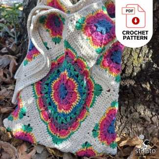 Reusable crochet shopping tote made with vibrant Crazy Daisy flower granny squares