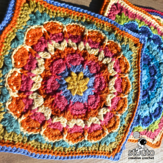 Crochet flower square showing dimensional floral centre