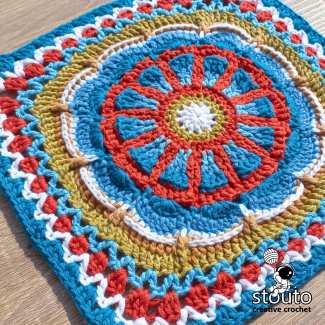 TMBJGF Flower Granny Square crochet pattern featuring a textured flower motif and classic granny square finish.