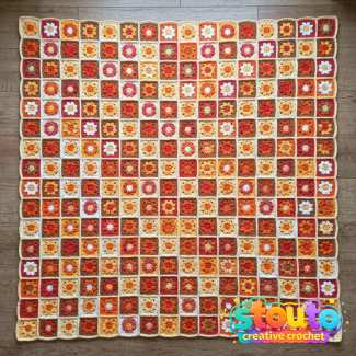 Crochet flower granny squares arranged as a colourful blanket project.