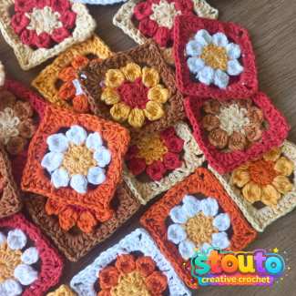Crochet flower granny square with an eight-petal flower centre  