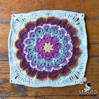 Floral granny square crochet pattern with textured petals and a modern flower design for afghan and blanket projects.