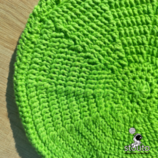 Crochet round bag back panel worked in textured front post double crochet stitche