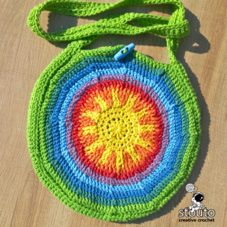 Colourful round crochet market bag with textured front post crochet stitches