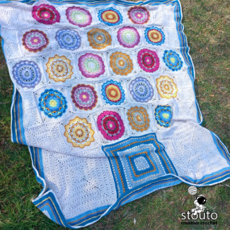This square is one of the 12 unique squares featured in the Flower Pot Granny Squares Blanket Pattern