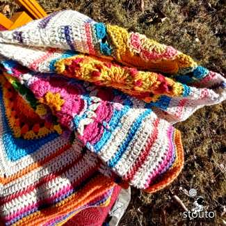 Folded crochet flower lapghan textured