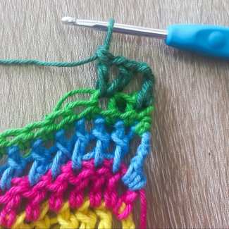 Row 8 – Skipped Stitches and V-Stitches