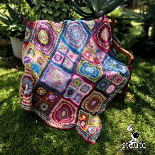 African inspired crochet blanket featuring bold floral textures