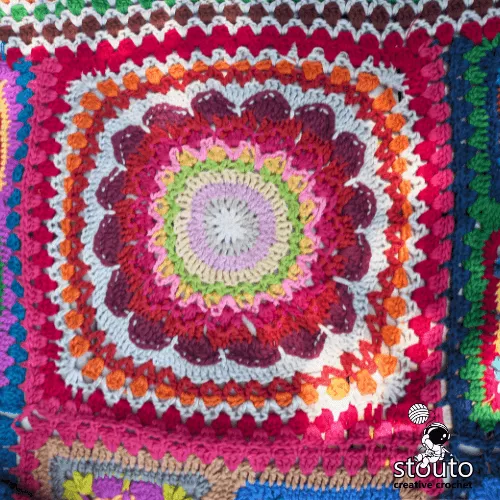 Crochet patchwork flower squares used in patchwork blanket design