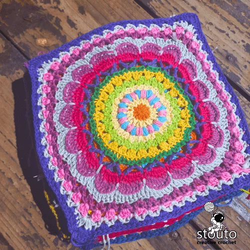 Modular crochet flower blanket squares forming African patchwork layout