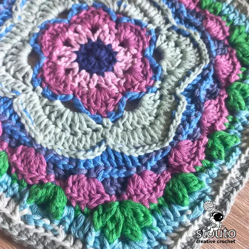 Bold Buttercup crochet square used as decorative cushion