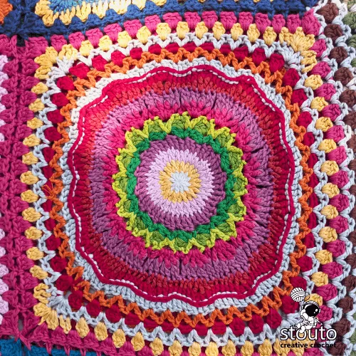 Bold floral granny square crochet motif with textured flower patchwork square