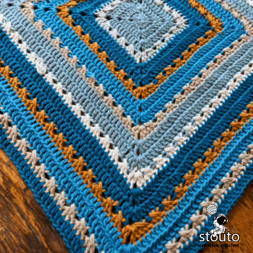 Baby-size crochet blanket example with soft drape and square shape