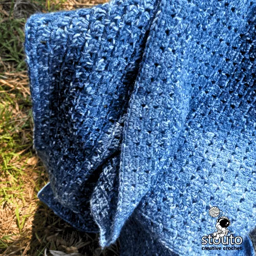 Modern granny square style crochet blanket using block stitch