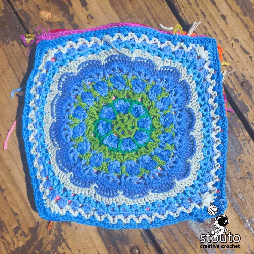 Crochet floral granny square petal texture detail with decorative stitches
