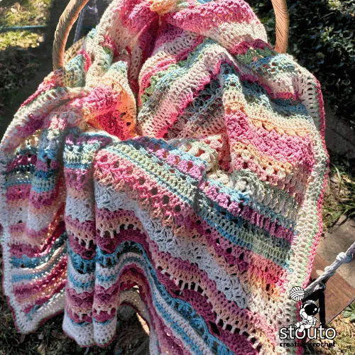 Rose crochet blanket stitch pattern with textured petal-like structure