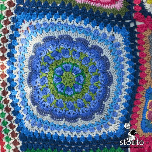 African Flowers Patchwork blanket assembly with large and small floral granny squares