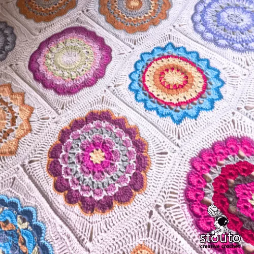 Close-up crochet flower granny square used in flower pot blanket.