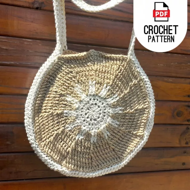 Crochet bag pattern flat lay with yarn and crochet hooks