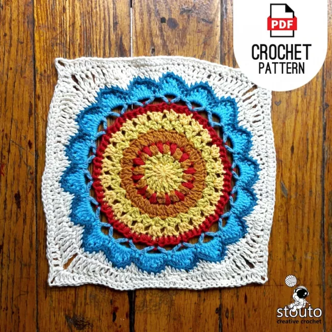 Crochet modern flower square with layered daisy petals worked in the round using puff stitches and front post crochet