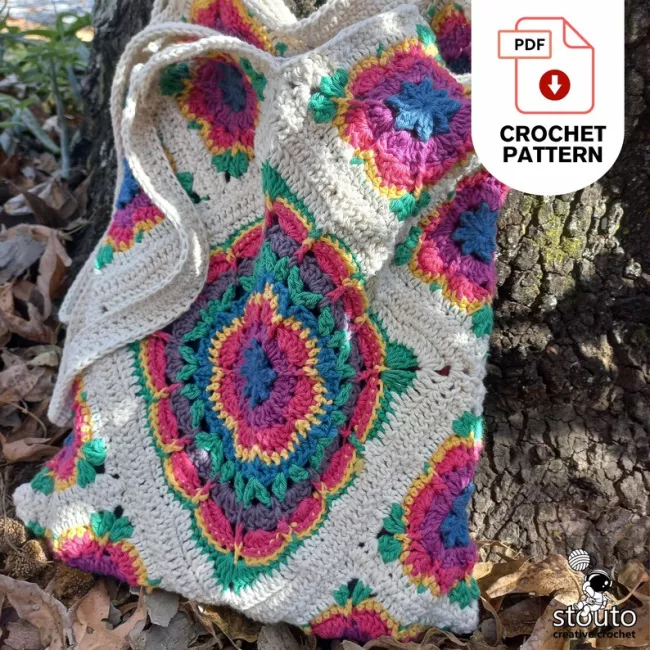 Reusable crochet shopping tote made with vibrant Crazy Daisy flower granny squares