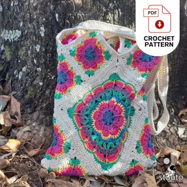 Crochet flower granny squares arranged before joining into a tote bag
