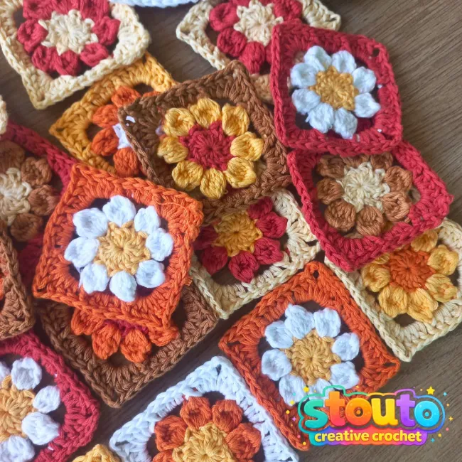 Crochet flower granny square with an eight-petal flower centre  