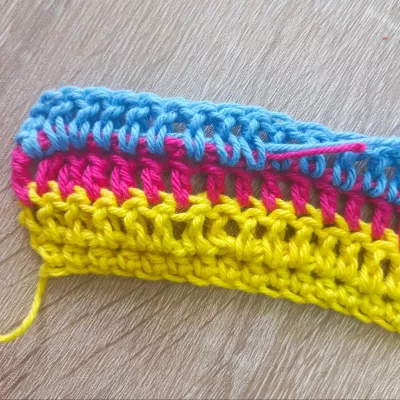 Work in crochet tail as you go along